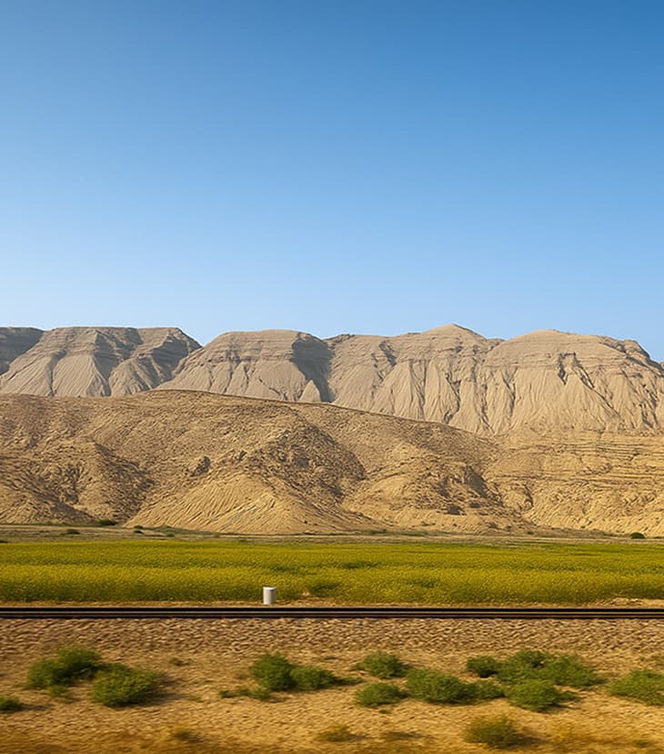 Mountainous terrain in Sindh with barren slopes and rocky landscape under clear desert sky" Alt Tag 2: htmlalt="Mountainous terrain in Sindh with barren slopes and rocky landscape under clear desert sky" Keywords: Sindh highlands, mountain terrain, desert mountains, natural landscape, rocky formations, arid topography, scenic views, geographical diversityRetryClaude does not have the ability to run the code it generates yet.Claude can make mistakes. Please double-check responses.