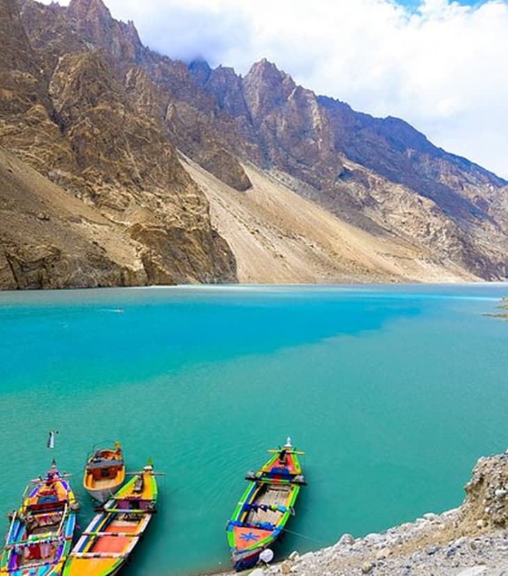Turquoise waters of Attabad Lake in Hunza Valley, a natural lake formed by a massive landslide in 2010, surrounded by dramatic mountain peaks in Gilgit-Baltistan