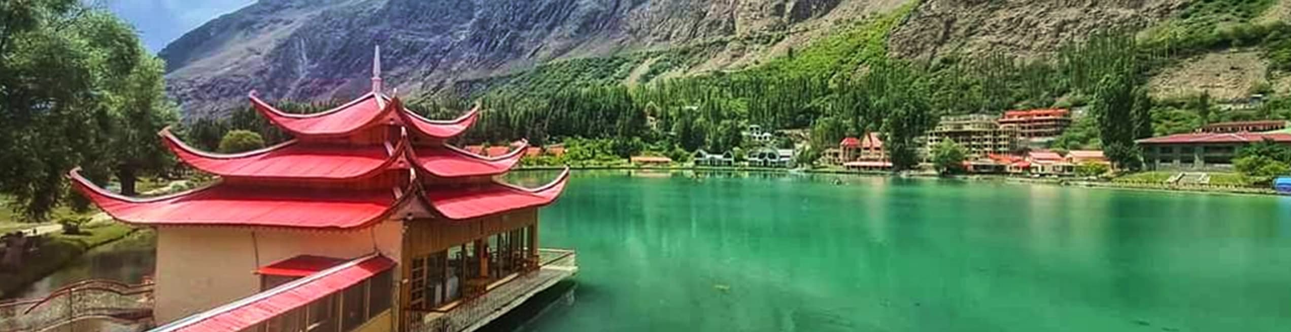 Shangrilla Resort situated on the shores of Lower Kachura Lake in Skardu, featuring traditional architecture amid stunning mountain scenery in Gilgit-Baltistan