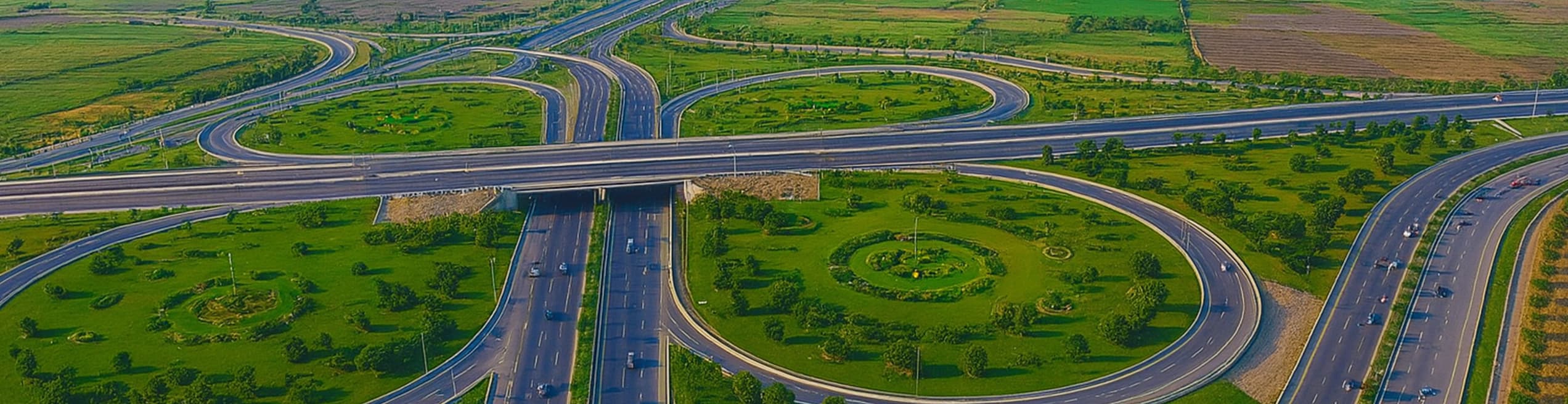 Multi-lane highway with vehicles traveling between urban areas, featuring modern road infrastructure and city connectivity