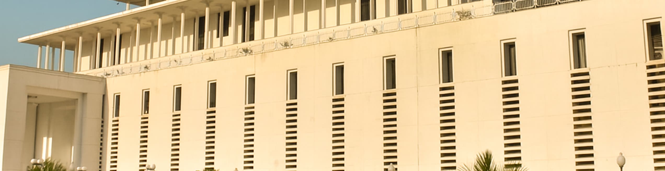 Contemporary parliament building with distinctive dome, modern governmental design, and formal legislative complex features