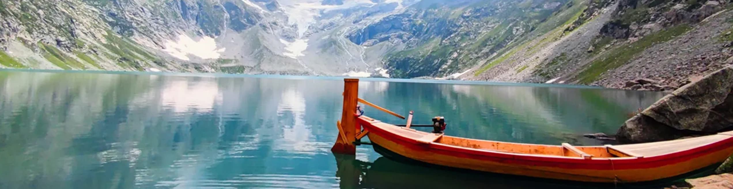 Banda, Dir Upper, KPK – lush green valley with alpine forests, mountain streams, and snow-covered peaks in the background.