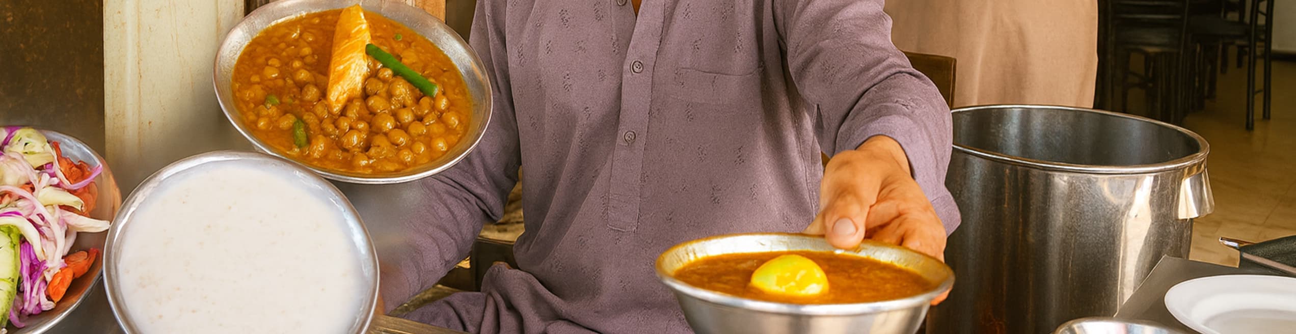 Traditional Pakistani breakfast of cholay with naan.