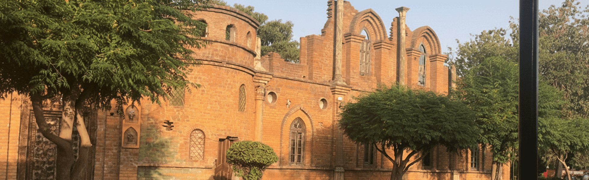 Wide banner view of Ayub National Park showcasing Jungle World Ayub Park and nearby zones, Ayub Park zoo area scene in Rawalpindi with visitor pathways and greenery