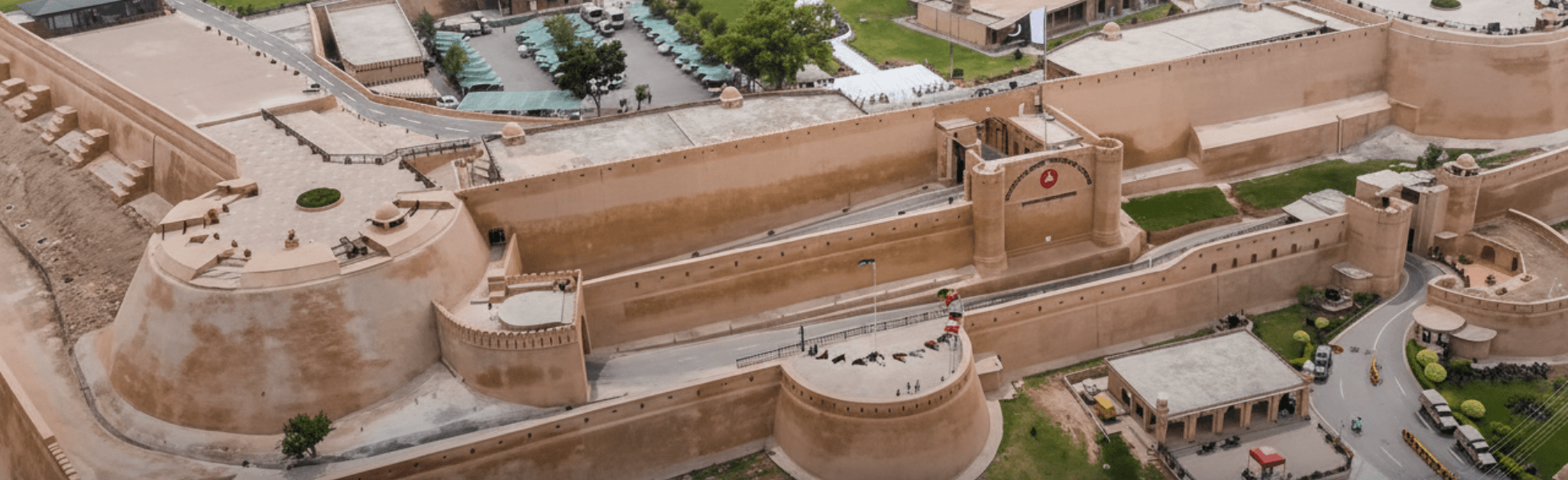 Wide banner view of Bala Hisar Fort in Peshawar showing the fort complex and hills backdrop, Bala Hisar Fort history landmark associated with Frontier Corps area in Peshawar