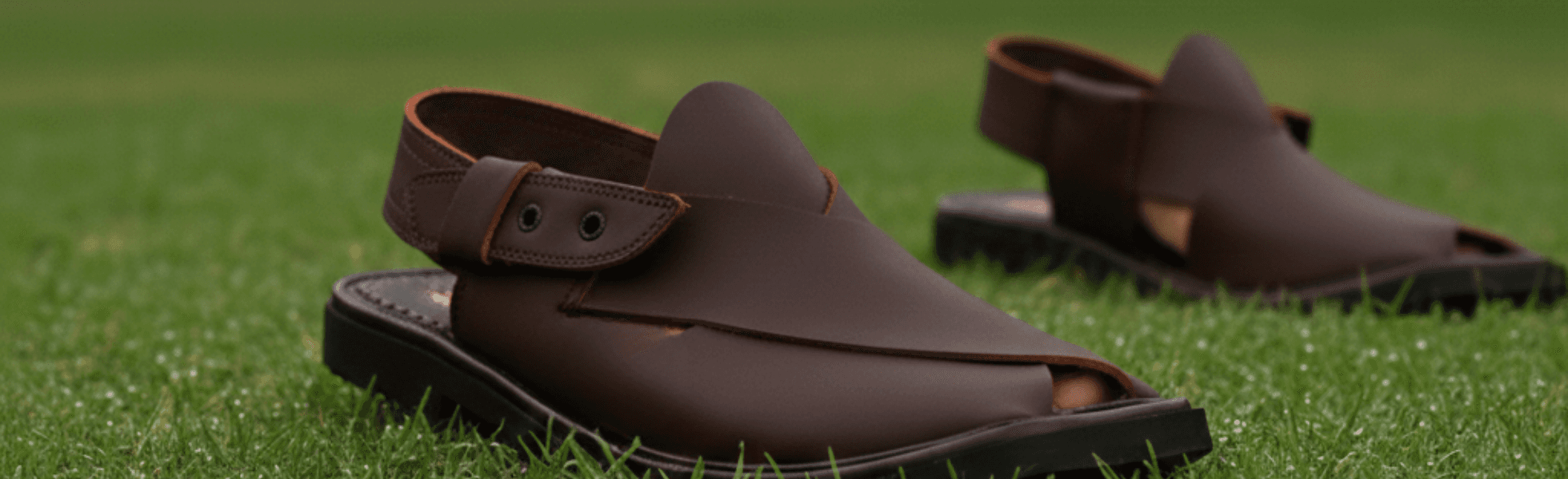 Banner view of black Peshawari chappal and brown Peshawari chappal displayed in a shop, Peshawari chappal store in Pakistan showing latest designs and price range