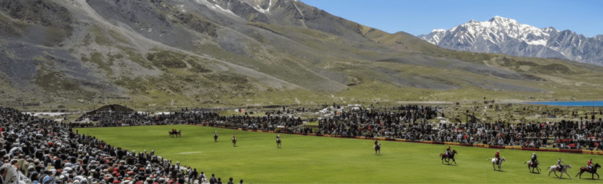 Wide banner view of Shandur Polo Festival crowd, tents, and mountain valley landscape, Gilgit Baltistan festivals scene highlighting polo sports and Pakistan tourism at Shandur