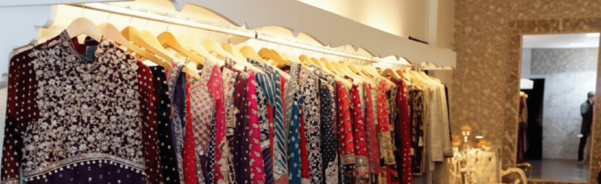 Wide banner view of Kamran Market Rawalpindi showing market lanes and multiple shop fronts, Wedding shopping scene in Saddar Rawalpindi near Kamran Market with dress shops and accessories