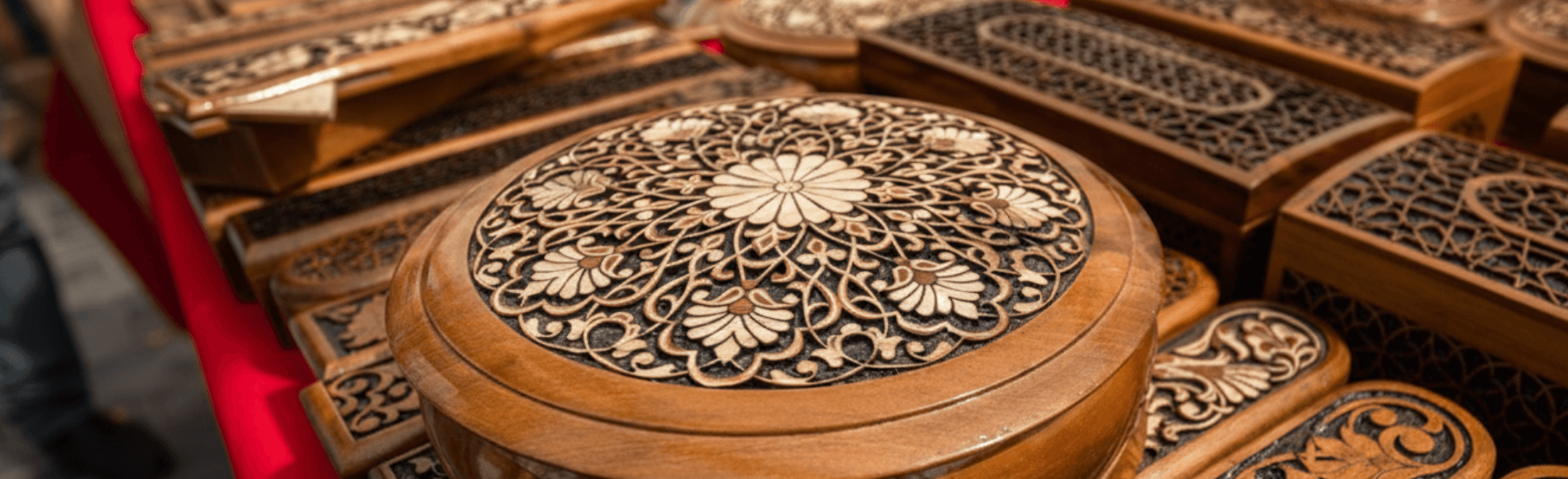 Wide banner view of Chiniot wood carving style furniture showing carved panels and artisan detail, Pakistani furniture designs featuring chinioti furniture and wooden handicrafts in walnut wood