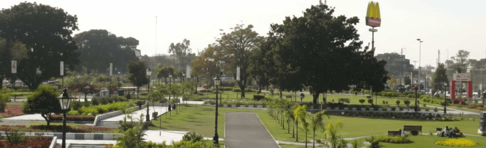 Wide banner view inside Jinnah Park showing Jinnah Park cinema area and nearby restaurants, Cinepax Jinnah Park ticket counter and activity zone with bowling and visitors