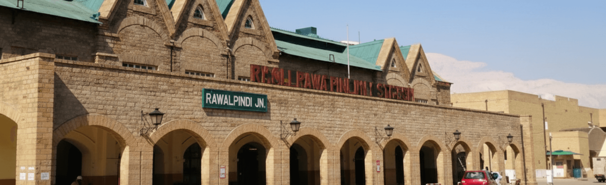 Wide banner view of Rawalpindi railway station booking office and concourse area, Rawalpindi train timings and train schedule board view for routes like Rawalpindi to Lahore