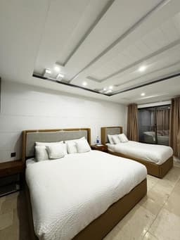 Family room bedroom with king and twin beds in Skardu, Best places to stay in Skardu for families