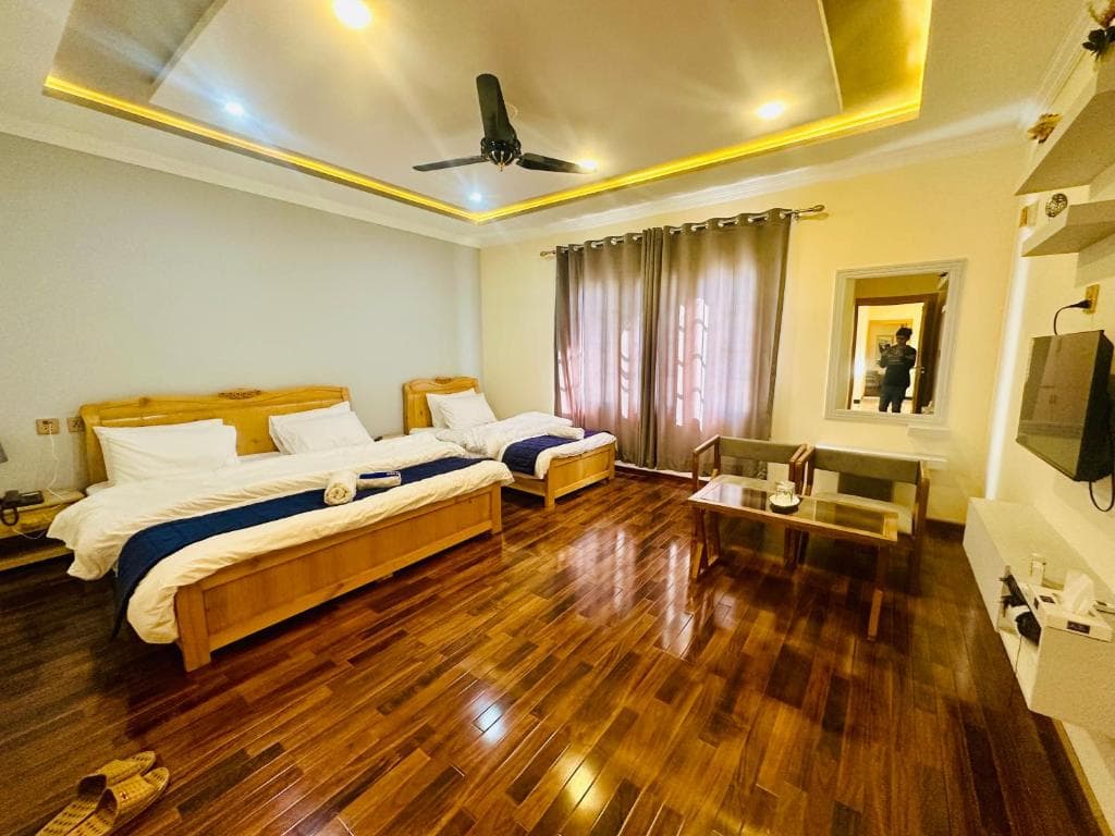 Hotel bedroom with twin and single bed layout, Comfortable family stay in Skardu hotel