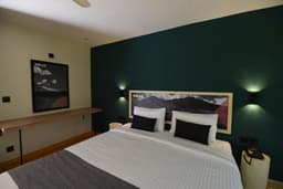 Queen bed in deluxe room with lake view in Skardu, Luxury bedroom with mountain view at Katpana Retreat