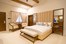 Executive Triple Room Sleeping Area at K2 Hotel by Green Pak Skardu  Executive triple room with large bed in Skardu hotel, Spacious bedroom interior with air conditioning at K2 Hotel Skardu