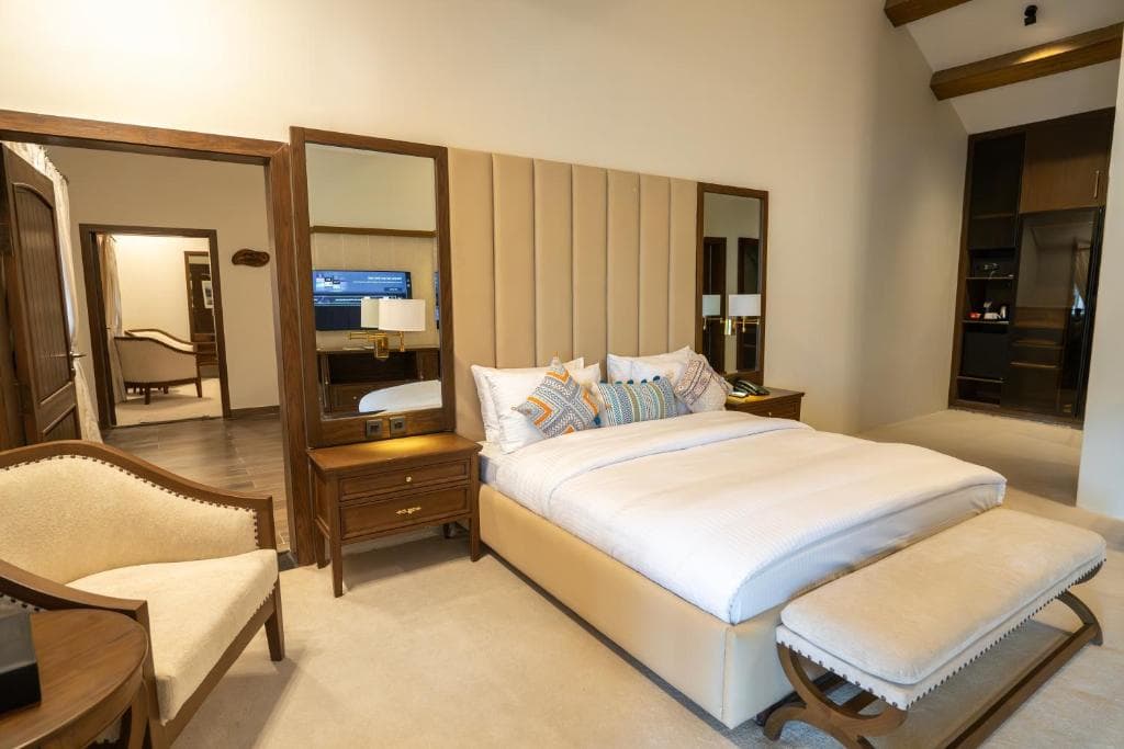 Spacious suite sleeping area with clean bedding in Skardu, Comfortable suite room interior with heating and WiFi