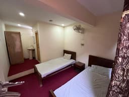 double room with bed and heating in Skardu hotel, Hotel Highlander Inn bedroom interior