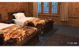 Basic triple room with three single beds in Skardu, Hotel Saspolo Skardu room interior with tiled floor