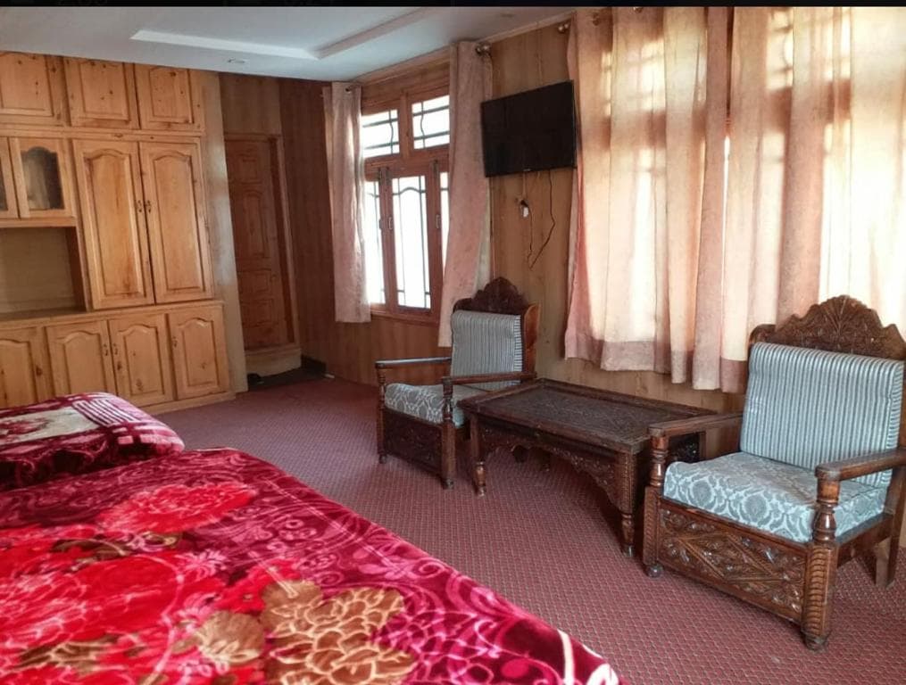 Triple room with single beds and balcony in Skardu hotel, city view room at Hotel Saspolo Skardu