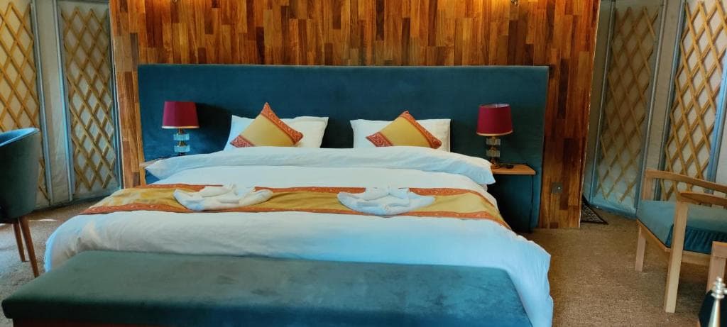 Double bed setup with modern interior in Skardu hotel, deluxe room at Apex Hotels and Resorts Skardu
