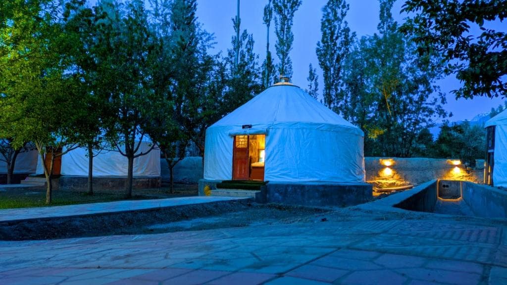 Exterior facade of Apex Hotels and Resorts on Airport Road Skardu, hotel building with mountain backdrop