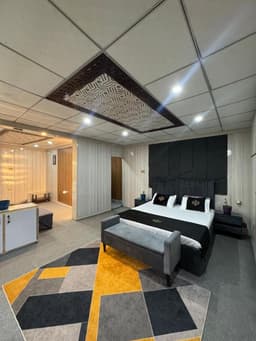 Family Suite Bedroom at Northlanders Guest House Skardu Family suite bedroom with clean beds in Skardu guest house, Cozy bedroom interior with mountain view at Northlanders Skardu