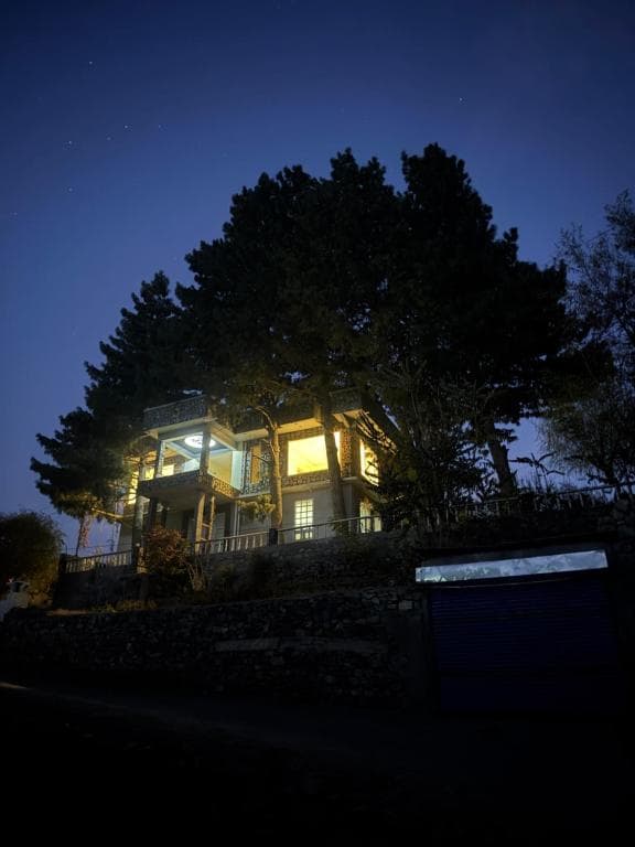 Northlanders Guest House Skardu Exterior View Guest house exterior in Skardu with trees and mountain backdrop, Northlanders Guest House building view near Skardu city